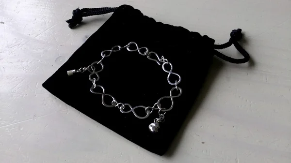 geboorte-armbandje; infinityschakels, 1e melktandje+kinderhoofdje